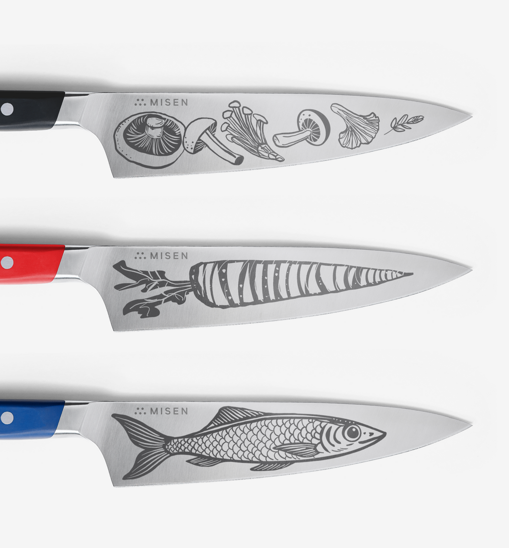 Misen kitchen knives with engraved mushroom, carrot, and fish illustrations on steel blades